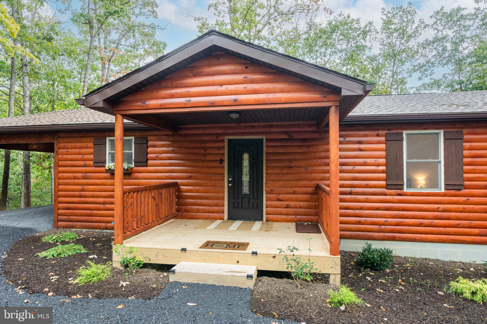 8258 Supinlick Ridge Road Basye, VA 22842 - Photo 2 of 65 Charming log cabin nestled in nature's embrace.
