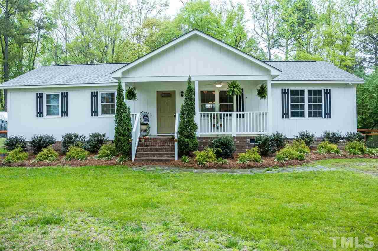 2009 Messer Road Raleigh, NC 27603 - Photo 1 of 30 a front view of a house with a yard and porch