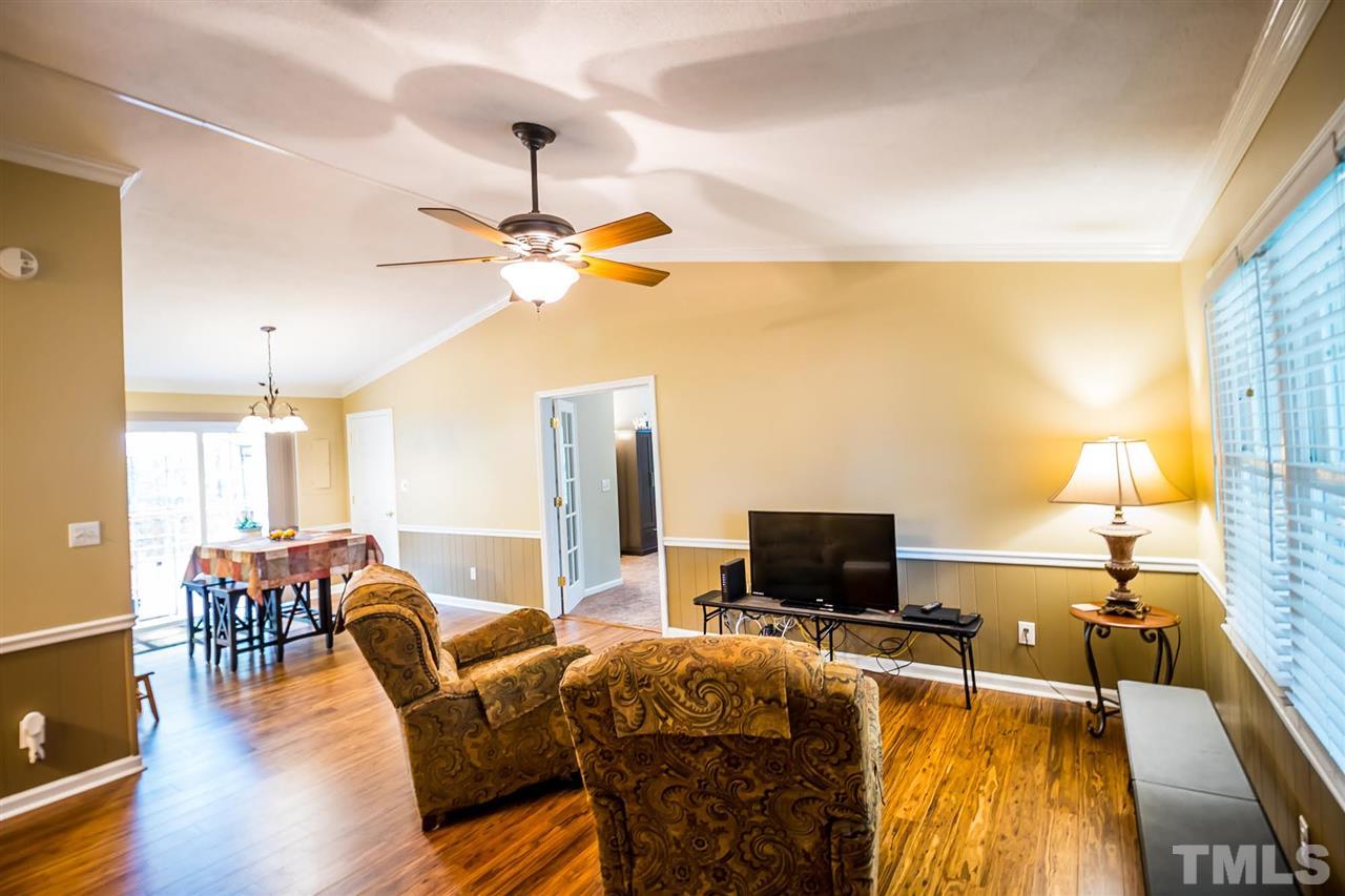 2009 Messer Road Raleigh, NC 27603 - Photo 11 of 30 a living room with furniture and a flat screen tv