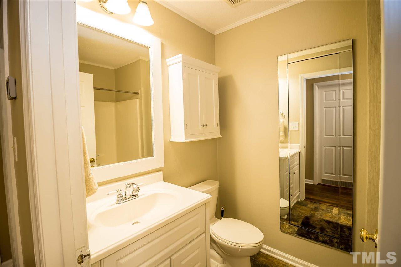 2009 Messer Road Raleigh, NC 27603 - Photo 20 of 30 a bathroom with a sink a toilet and shower