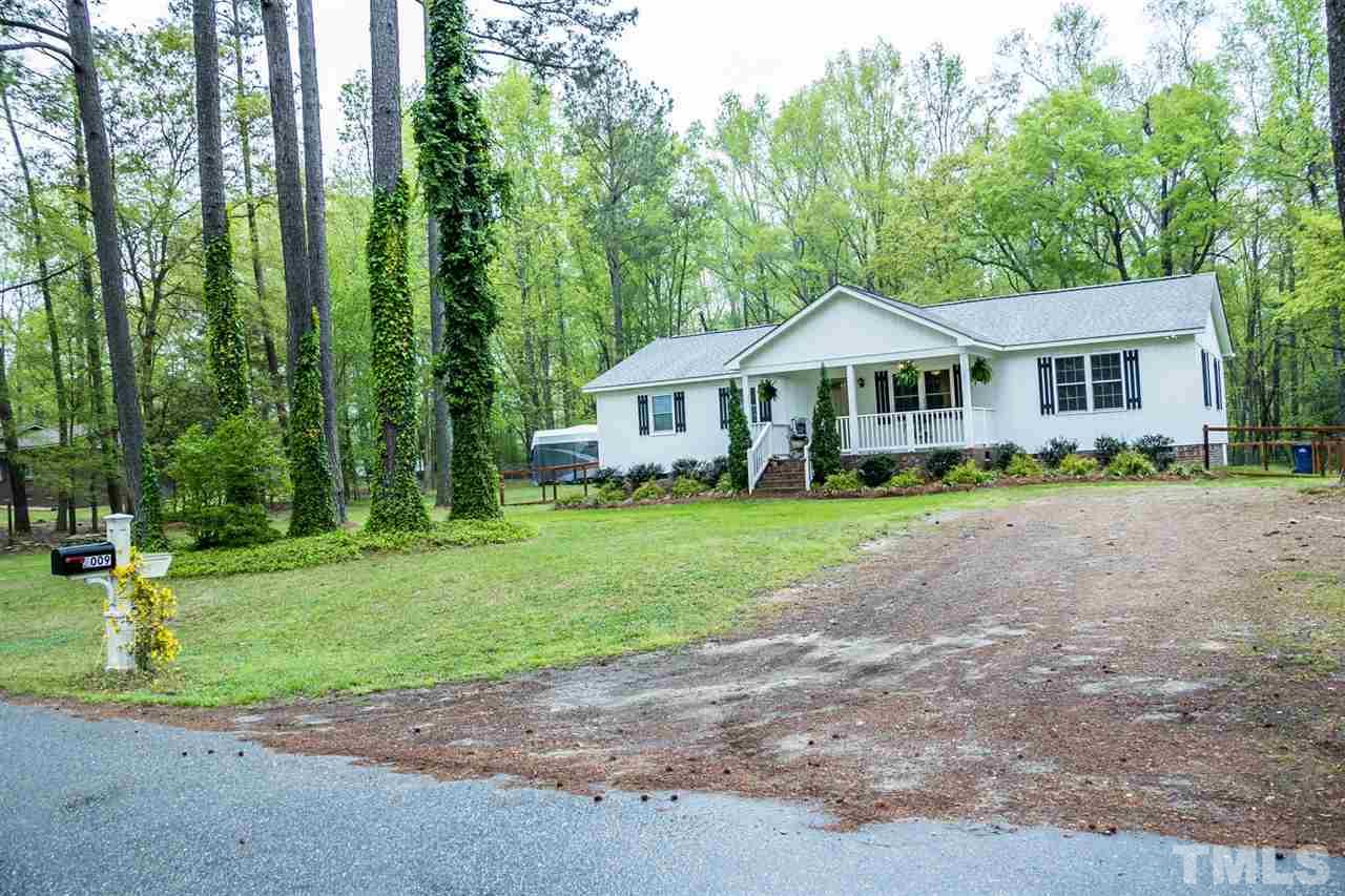 2009 Messer Road Raleigh, NC 27603 - Photo 3 of 30 a front view of a house with a yard