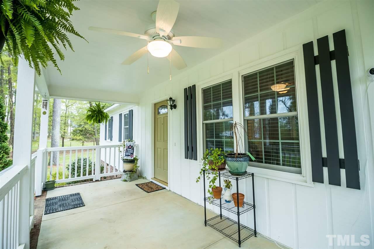 2009 Messer Road Raleigh, NC 27603 - Photo 5 of 30 a view of a porch with a table and chairs