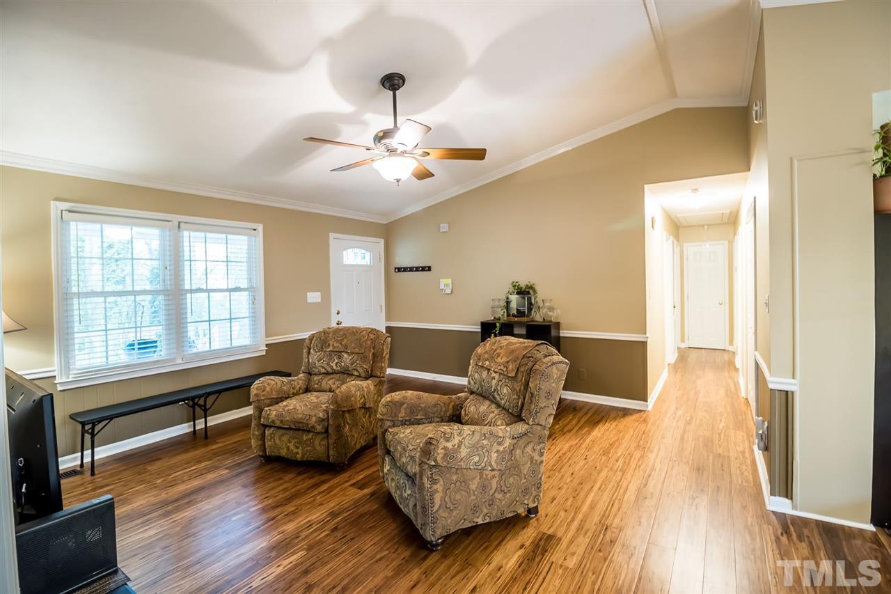 2009 Messer Road Raleigh, NC 27603 - Photo 7 of 30 a living room with furniture and wooden floor