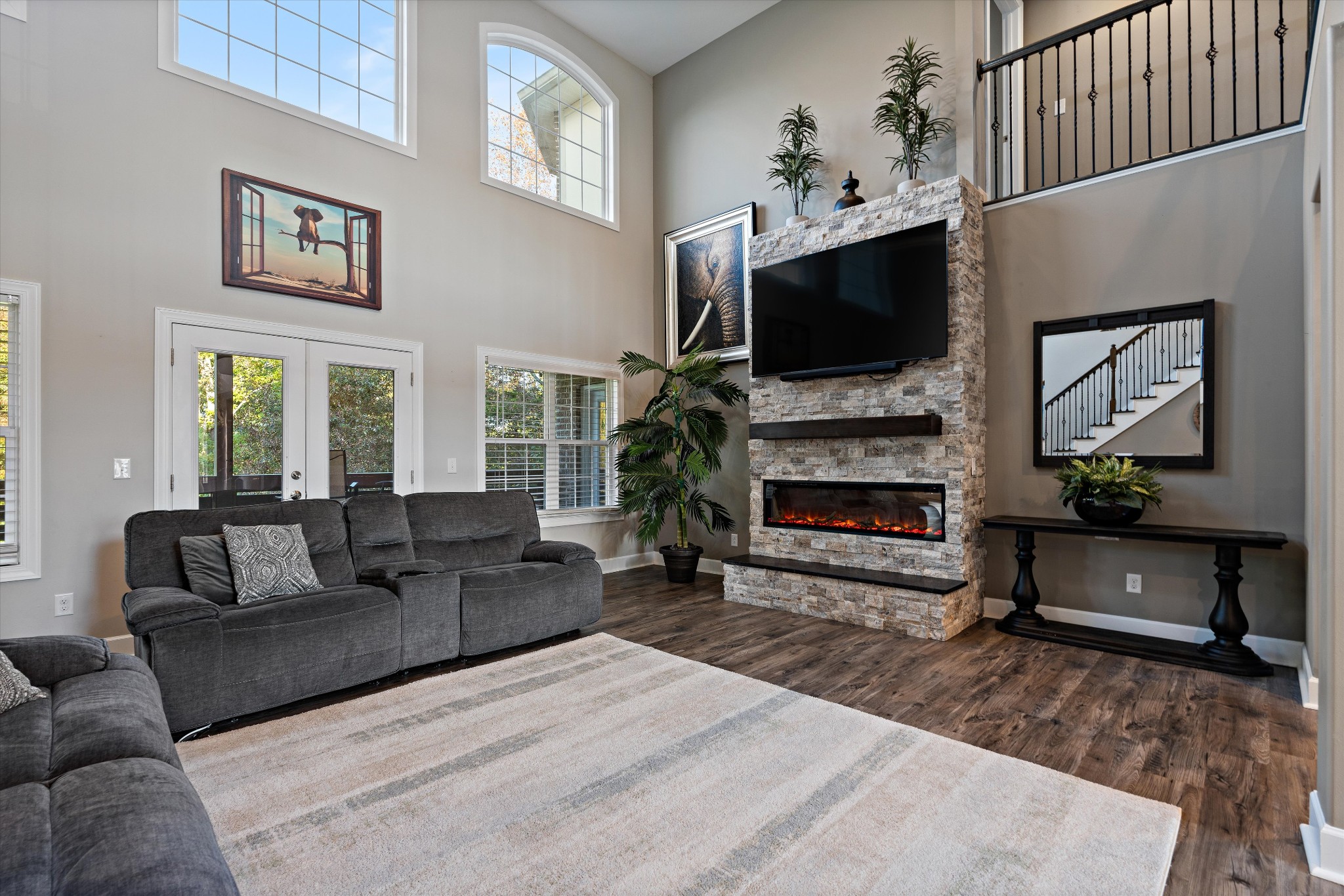 123 Chesapeake Court Lebanon, TN 37087 - Photo 12 of 62 a living room with furniture a flat screen tv and a fireplace