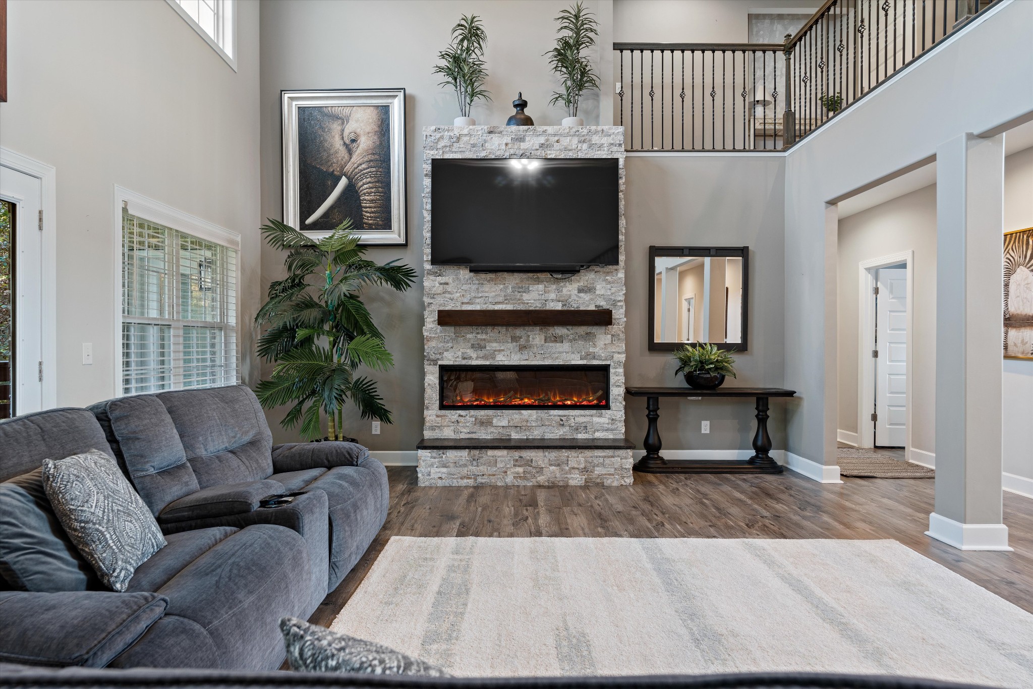 123 Chesapeake Court Lebanon, TN 37087 - Photo 13 of 62 a living room with furniture a flat screen tv and a fireplace