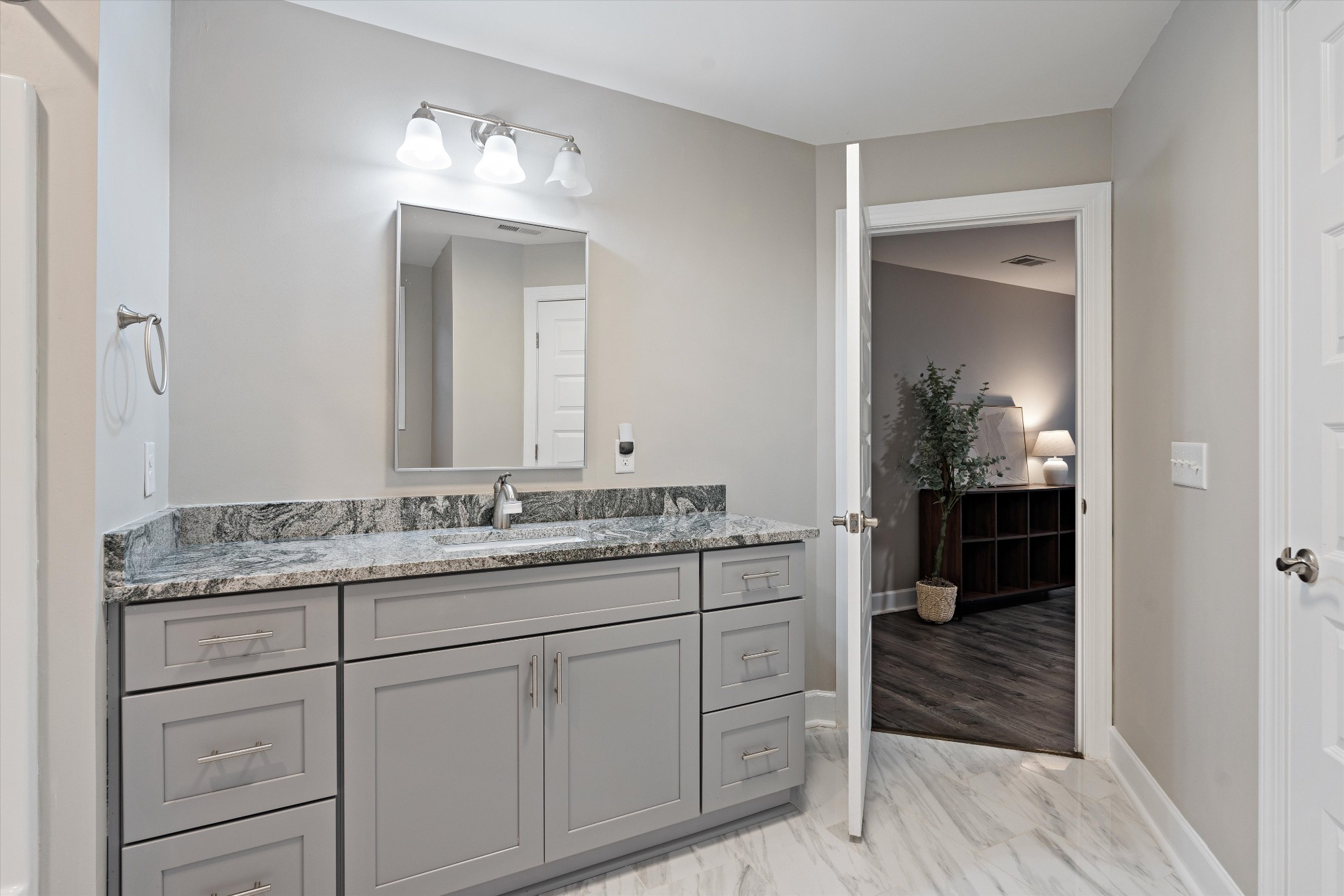 123 Chesapeake Court Lebanon, TN 37087 - Photo 37 of 62 a en suite bathroom with a granite countertop sink and a mirror