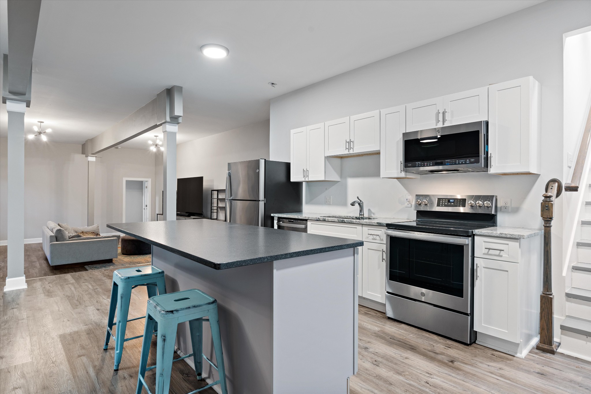 123 Chesapeake Court Lebanon, TN 37087 - Photo 38 of 62 a kitchen with stainless steel appliances a stove sink microwave and cabinets