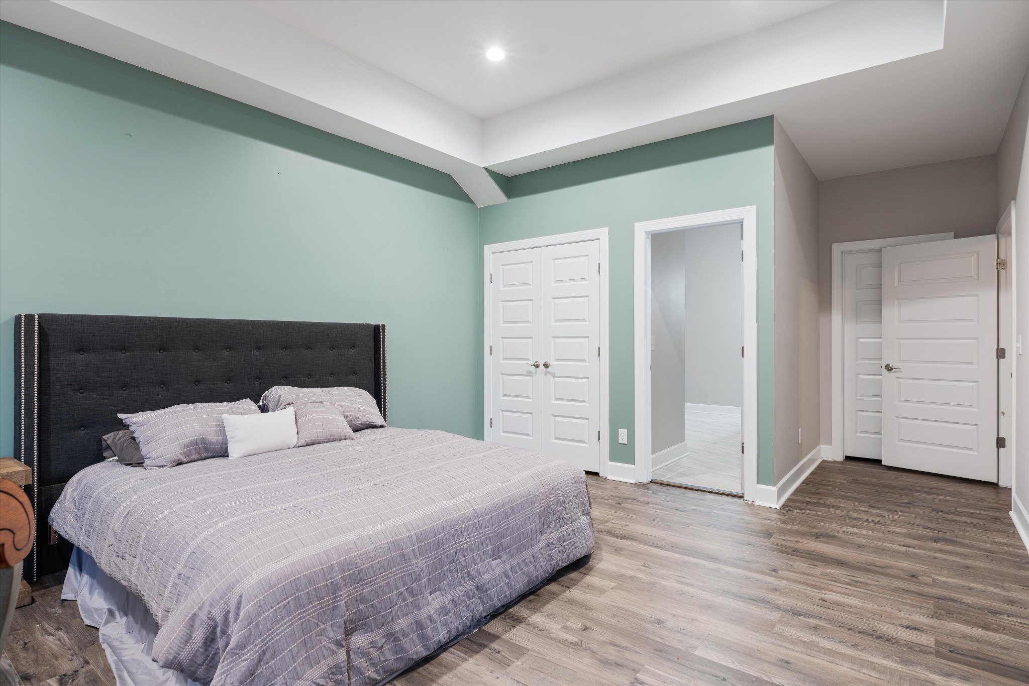 123 Chesapeake Court Lebanon, TN 37087 - Photo 46 of 62 a bedroom with a bed and wooden floor