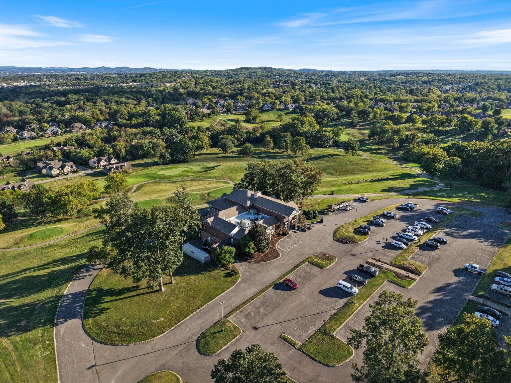 123 Chesapeake Court Lebanon, TN 37087 - Photo 58 of 62 an aerial view of a city with lots of residential buildings ocean and mountain view in back