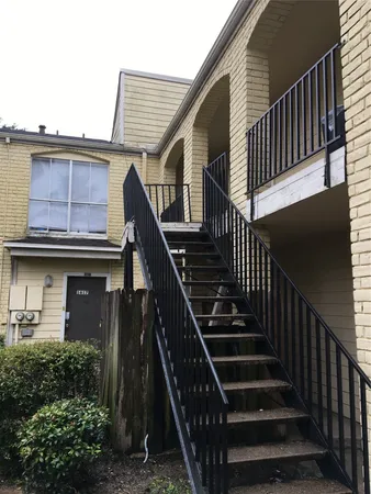 a view of entryway with wooden floor and stairs