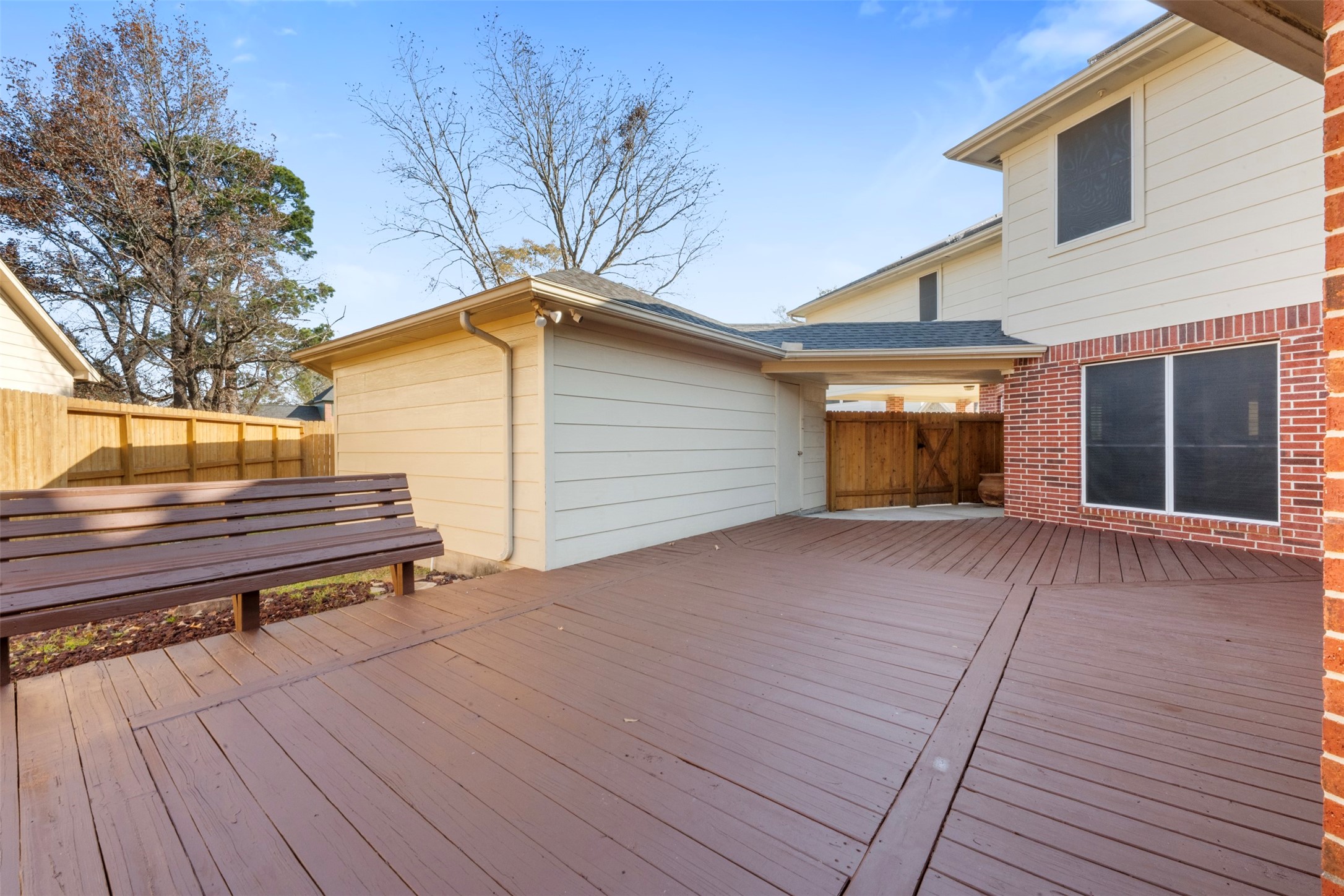 2406 Spanish Oak Hill Court Spring, TX 77388 - Photo 40 of 44 a view of backyard with wooden stairs and a large tree