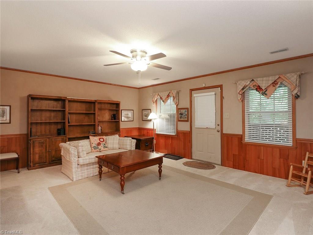 540 Lindley Road Greensboro, NC 27410 - Photo 18 of 29 Den has direct access to enclosed brick patio.
