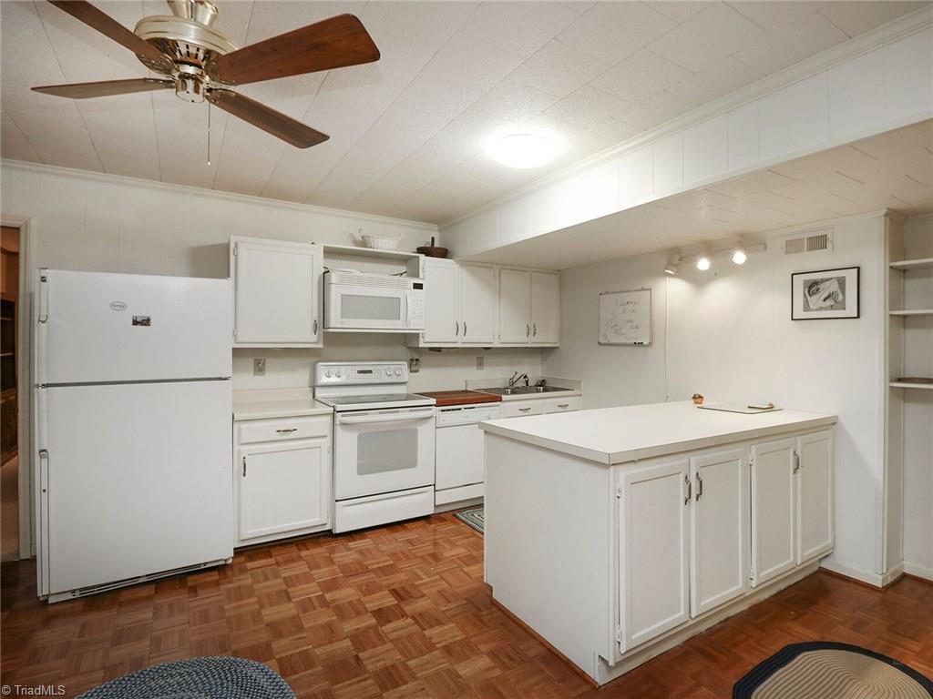 540 Lindley Road Greensboro, NC 27410 - Photo 19 of 29 Lower level kitchen fully equipped! Perfect if you are looking for an in-law suite OR what a great addition to a recreation room.