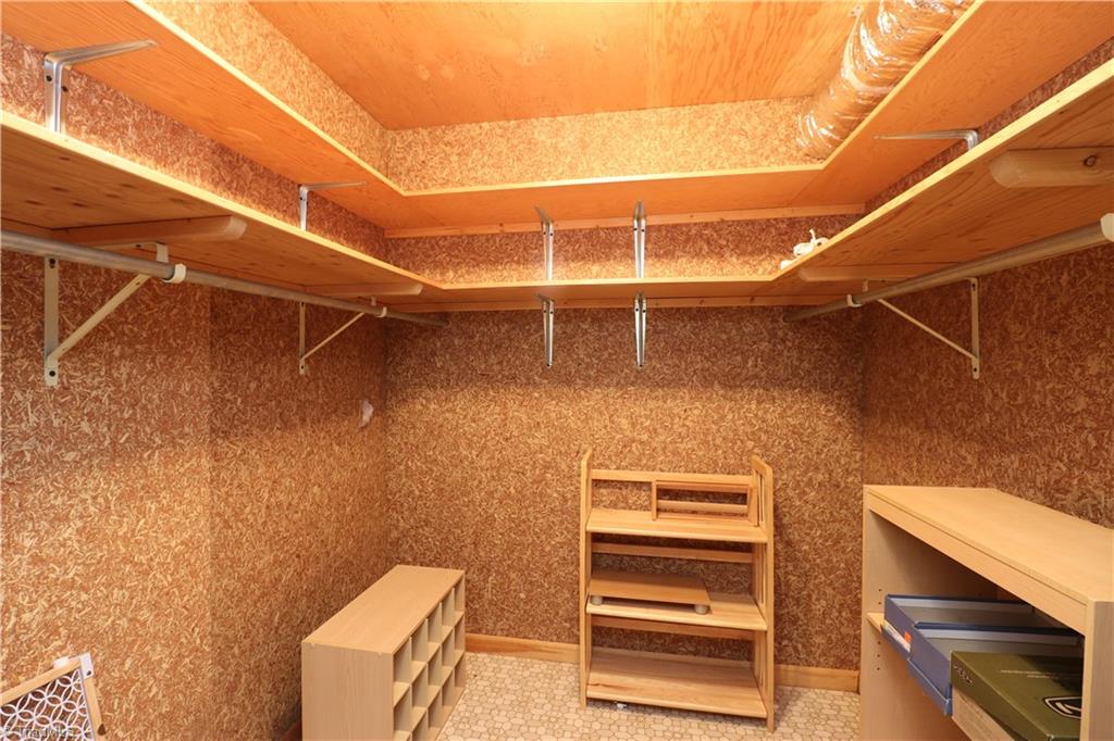 540 Lindley Road Greensboro, NC 27410 - Photo 24 of 29 Large walk in cedar closet great for out of season storage.