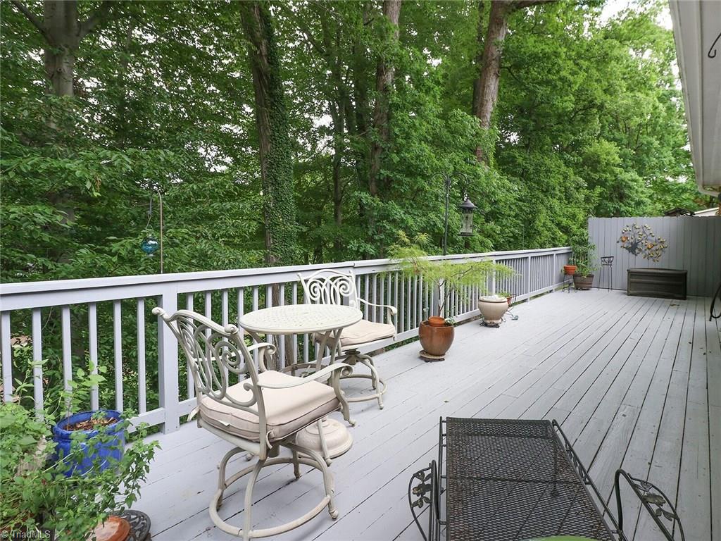 540 Lindley Road Greensboro, NC 27410 - Photo 26 of 29 Relax and enjoy life on this large patio. Almost feels like you are in a tree house.