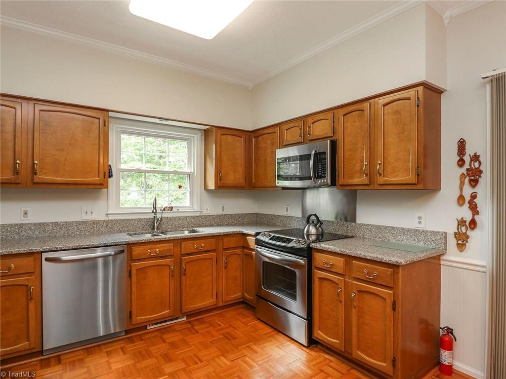 540 Lindley Road Greensboro, NC 27410 - Photo 8 of 29 Updated kitchen with stainless steel appliances and granite counter-tops