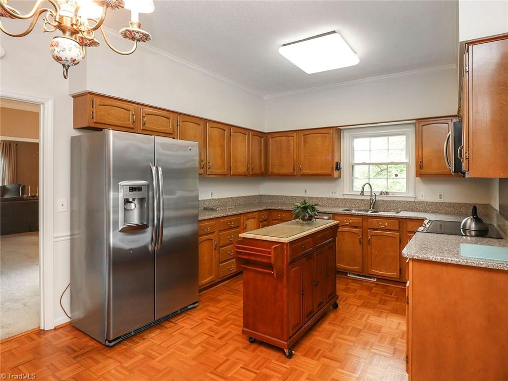 540 Lindley Road Greensboro, NC 27410 - Photo 9 of 29 Wood parquet floors and a movable island complete the work area of this kitchen