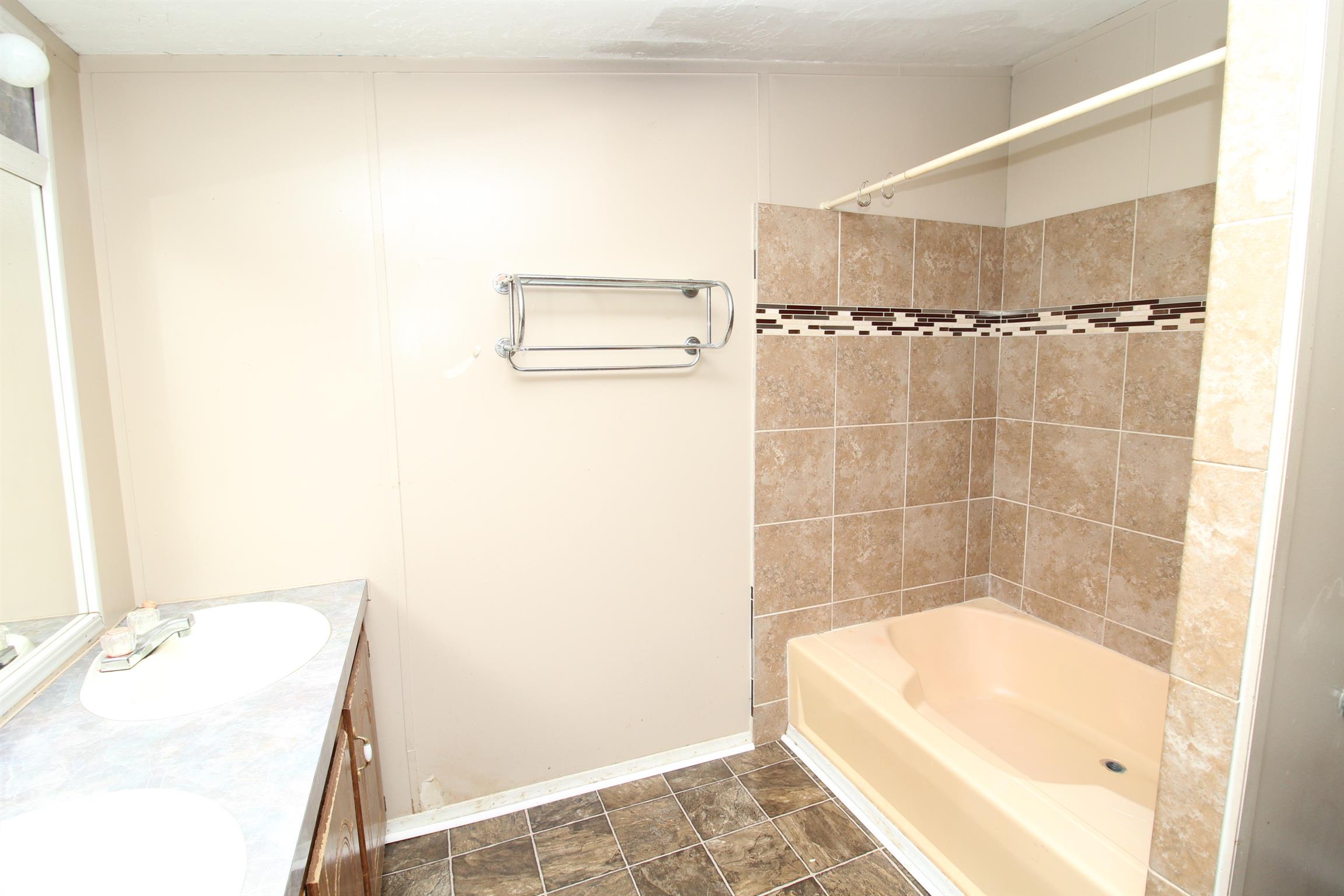 1333 Good Hope Cemetery Road Oak Grove, KY 42262 - Photo 6 of 11 a bathroom with a tub and shower