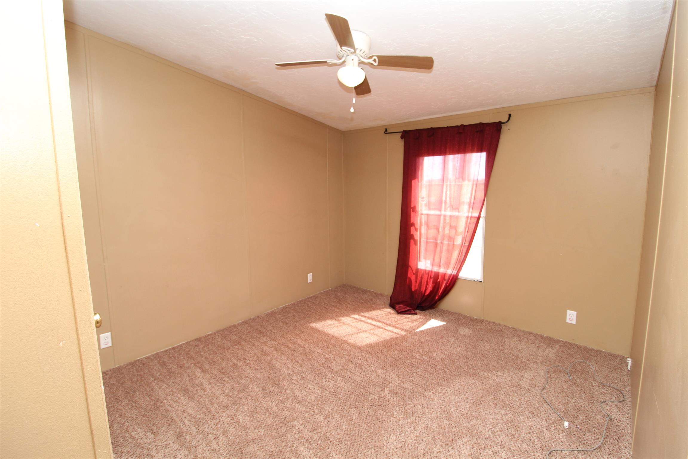 1333 Good Hope Cemetery Road Oak Grove, KY 42262 - Photo 8 of 11 an empty room with windows and fan