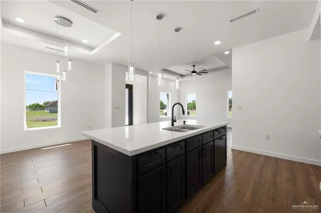 a bathroom with a sink vanity granite and a mirror