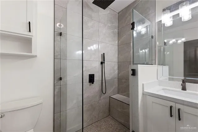 a bathroom with a shower and a sink