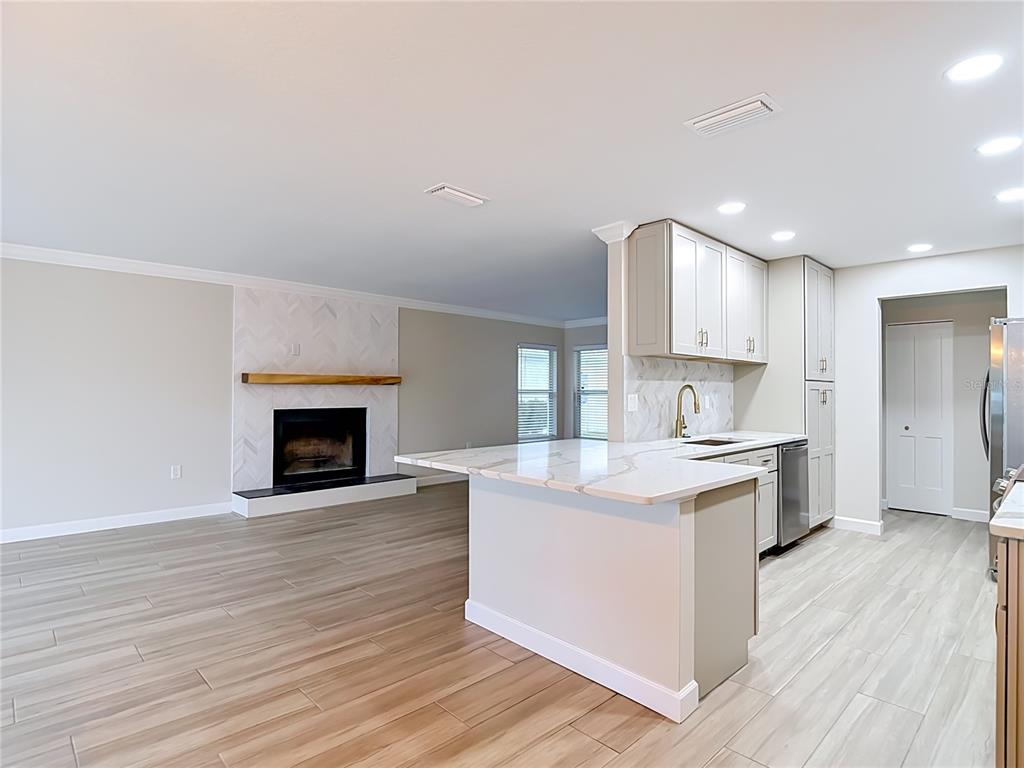 4536 Mitcher Road New Port Richey, FL 34652 - Photo 36 of 46 a large kitchen with a sink and a stove top oven