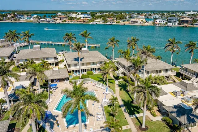 an aerial view of a house with a lake view