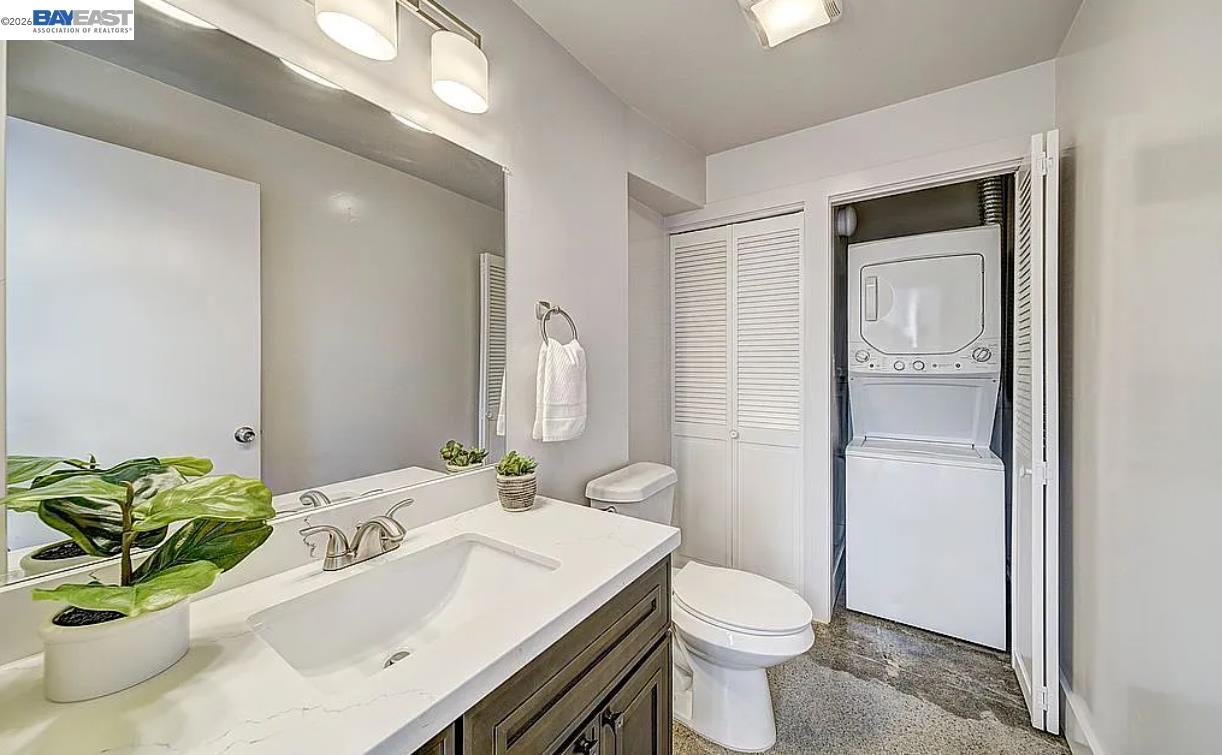 1451 13th Street, Unit 1 Oakland, CA 94607 - Photo 6 of 10 a bathroom with a sink toilet and shower