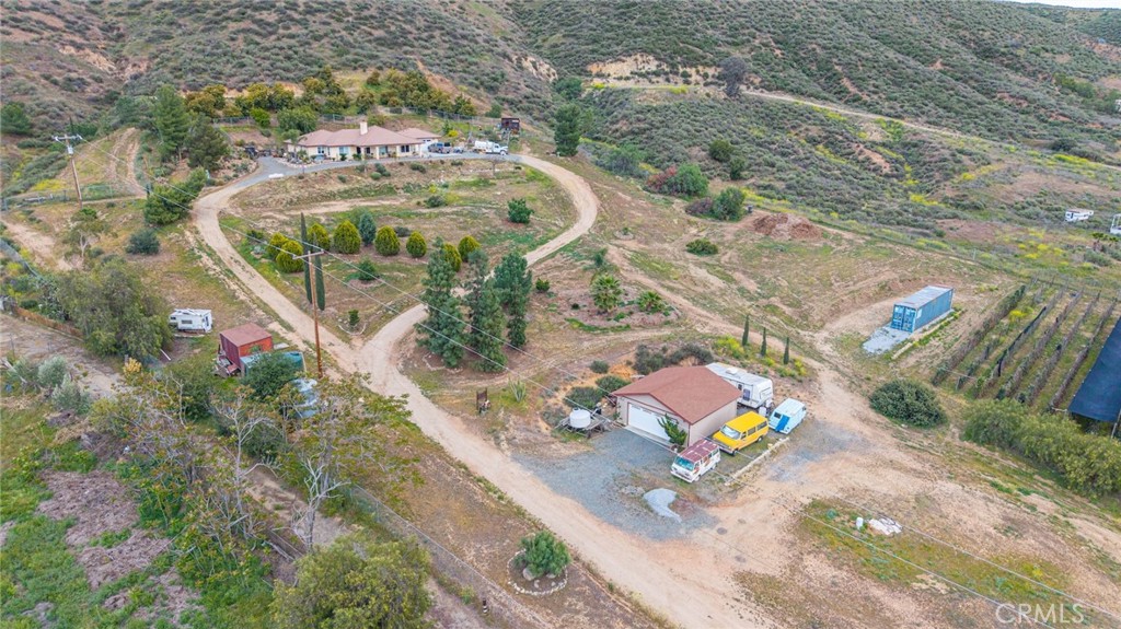 23850 Estelle Mountain Road Perris, CA 92570 - Photo 11 of 23 an aerial view of a swimming pool with outdoor seating