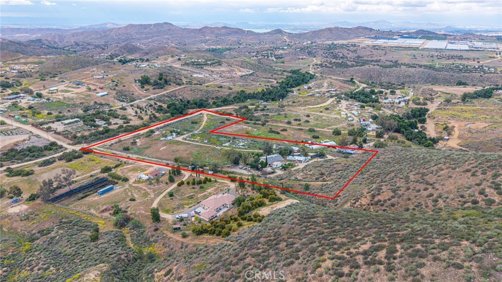23850 Estelle Mountain Road Perris, CA 92570 - Photo 2 of 23 an aerial view of residential house and sandy dunes