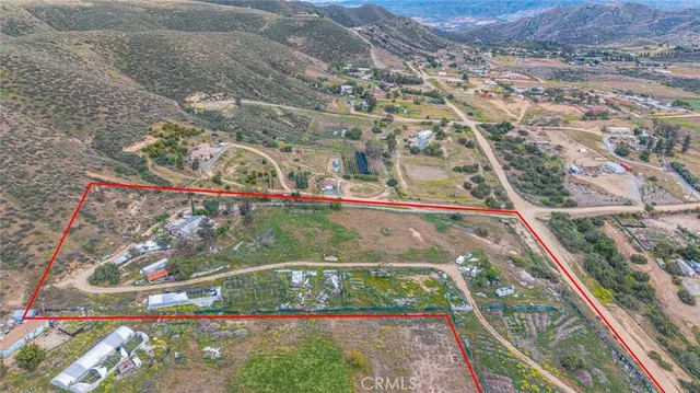 a view of a swimming pool with a yard