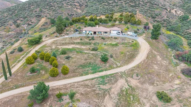 a view of a wooden house with a yard