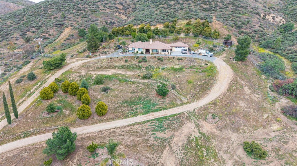 23850 Estelle Mountain Road Perris, CA 92570 - Photo 9 of 23 a view of a swimming pool with a yard