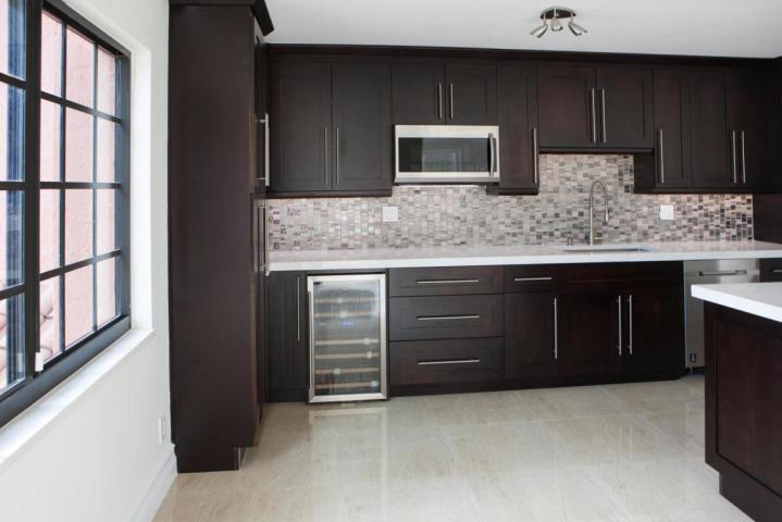 a kitchen with stainless steel appliances granite countertop a stove and a sink