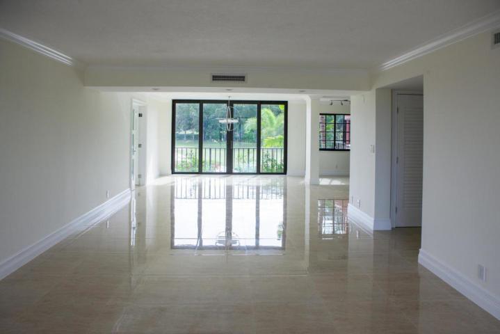 250 East Royal Palm Road, Unit 2A Boca Raton, FL 33432 - Photo 15 of 26 wooden floor in an empty room with a window