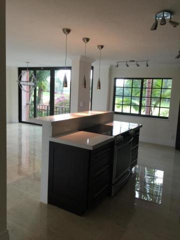 250 East Royal Palm Road, Unit 2A Boca Raton, FL 33432 - Photo 2 of 26 a room with a large window and chandelier