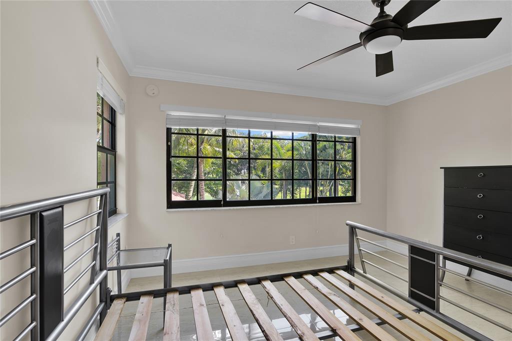250 East Royal Palm Road, Unit 2A Boca Raton, FL 33432 - Photo 23 of 26 a view of an empty room with a window and wooden floor