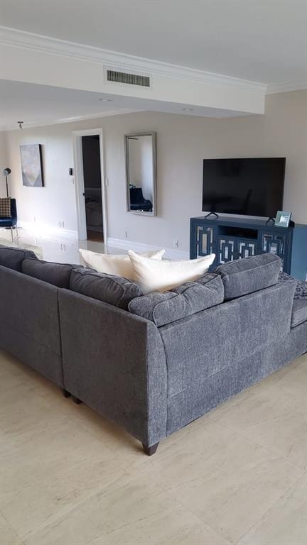 250 East Royal Palm Road, Unit 2A Boca Raton, FL 33432 - Photo 6 of 26 a living room with furniture and a flat screen tv