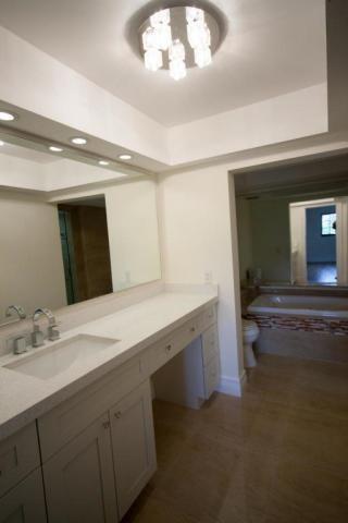 250 East Royal Palm Road, Unit 2A Boca Raton, FL 33432 - Photo 10 of 26 a bathroom with a sink and a mirror