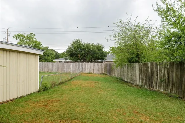 a view of backyard with small cabin