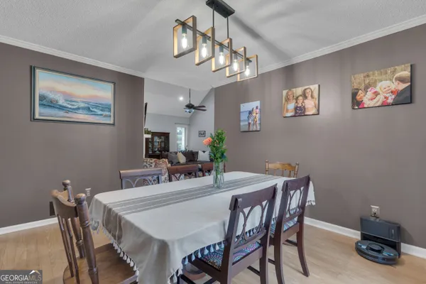 a kitchen with stainless steel appliances a stove a microwave and cabinets