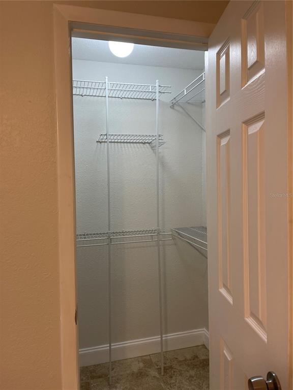 455 Alt 19, Unit 44 Palm Harbor, FL 34683 - Photo 15 of 22 a bathroom with a glass shower door