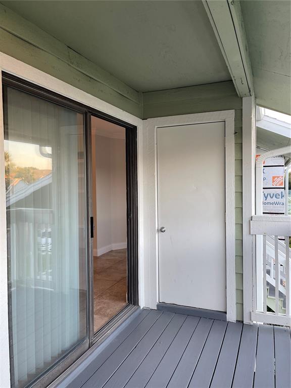 455 Alt 19, Unit 44 Palm Harbor, FL 34683 - Photo 21 of 22 a view of an empty room with wooden floor and a window