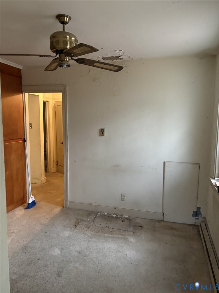 1208 Leicester Road Richmond, VA 23225 - Photo 4 of 9 an empty room with a ceiling fan