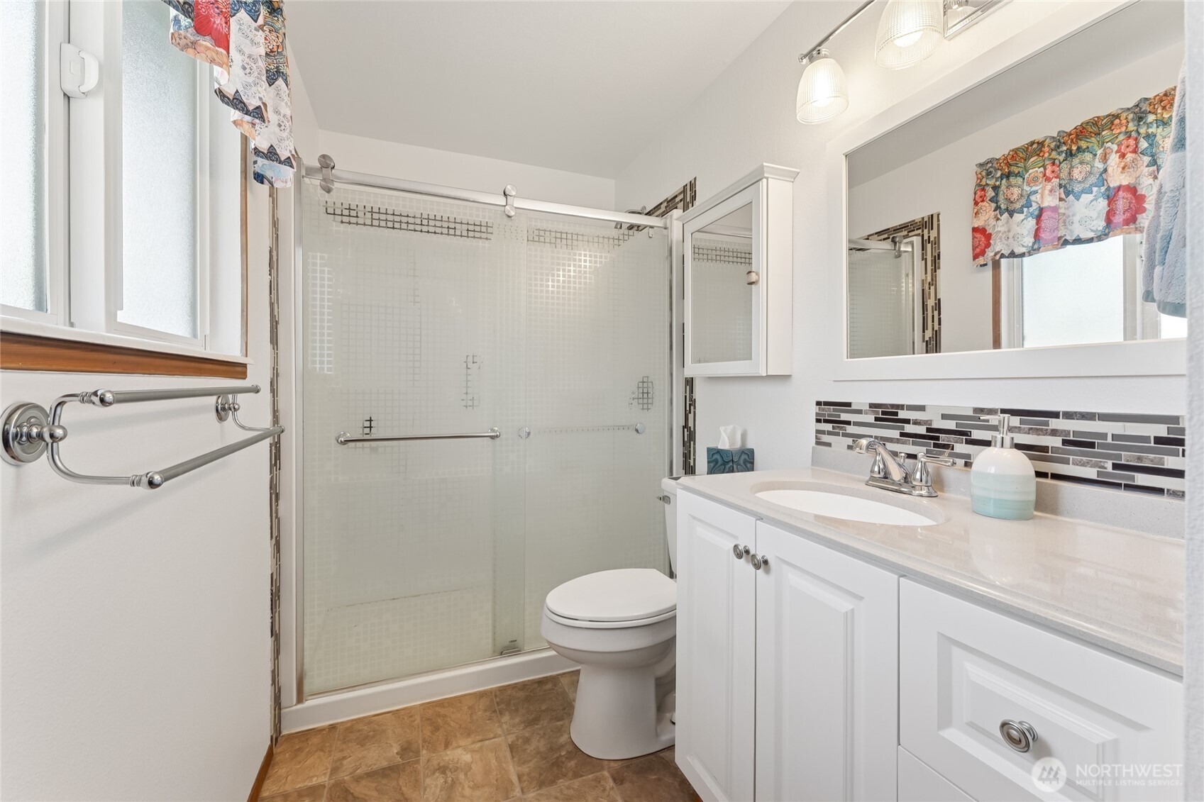 2402 Southeast 21st Street Renton, WA 98055 - Photo 11 of 24 a bathroom with a sink toilet and shower