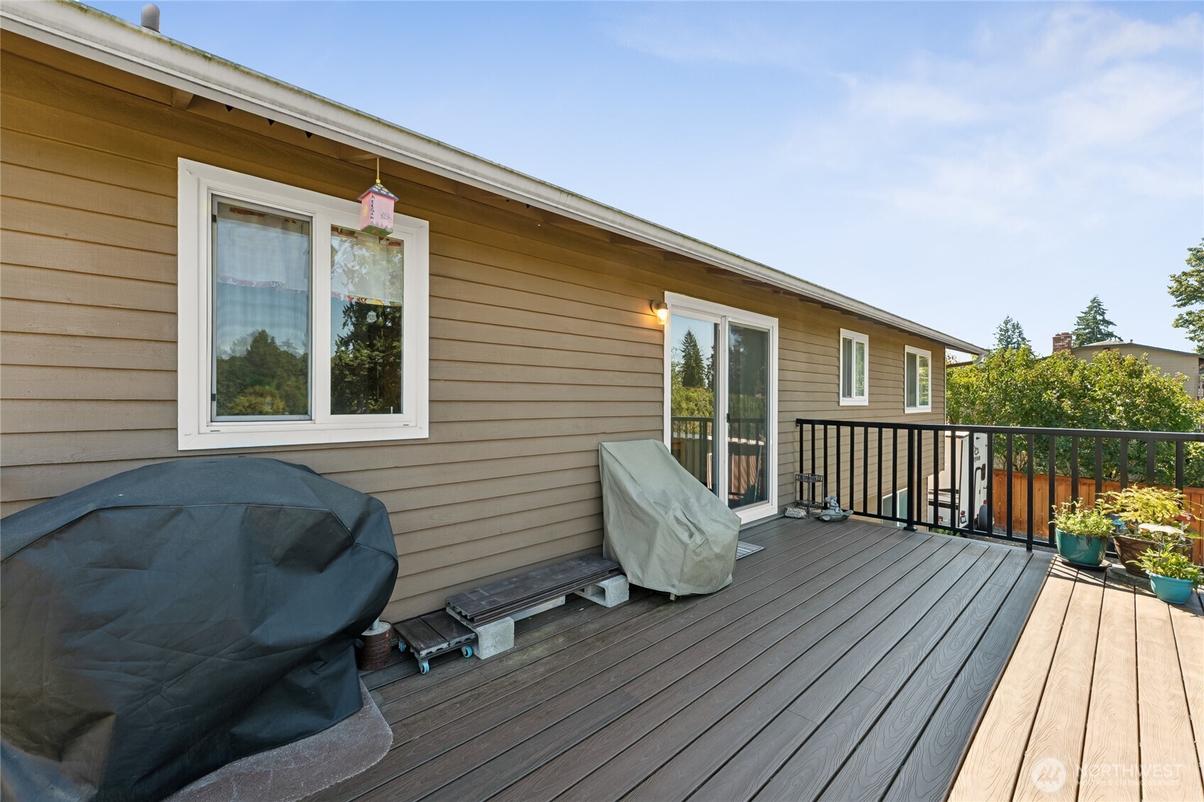 2402 Southeast 21st Street Renton, WA 98055 - Photo 15 of 24 a balcony with furniture and a wooden floor