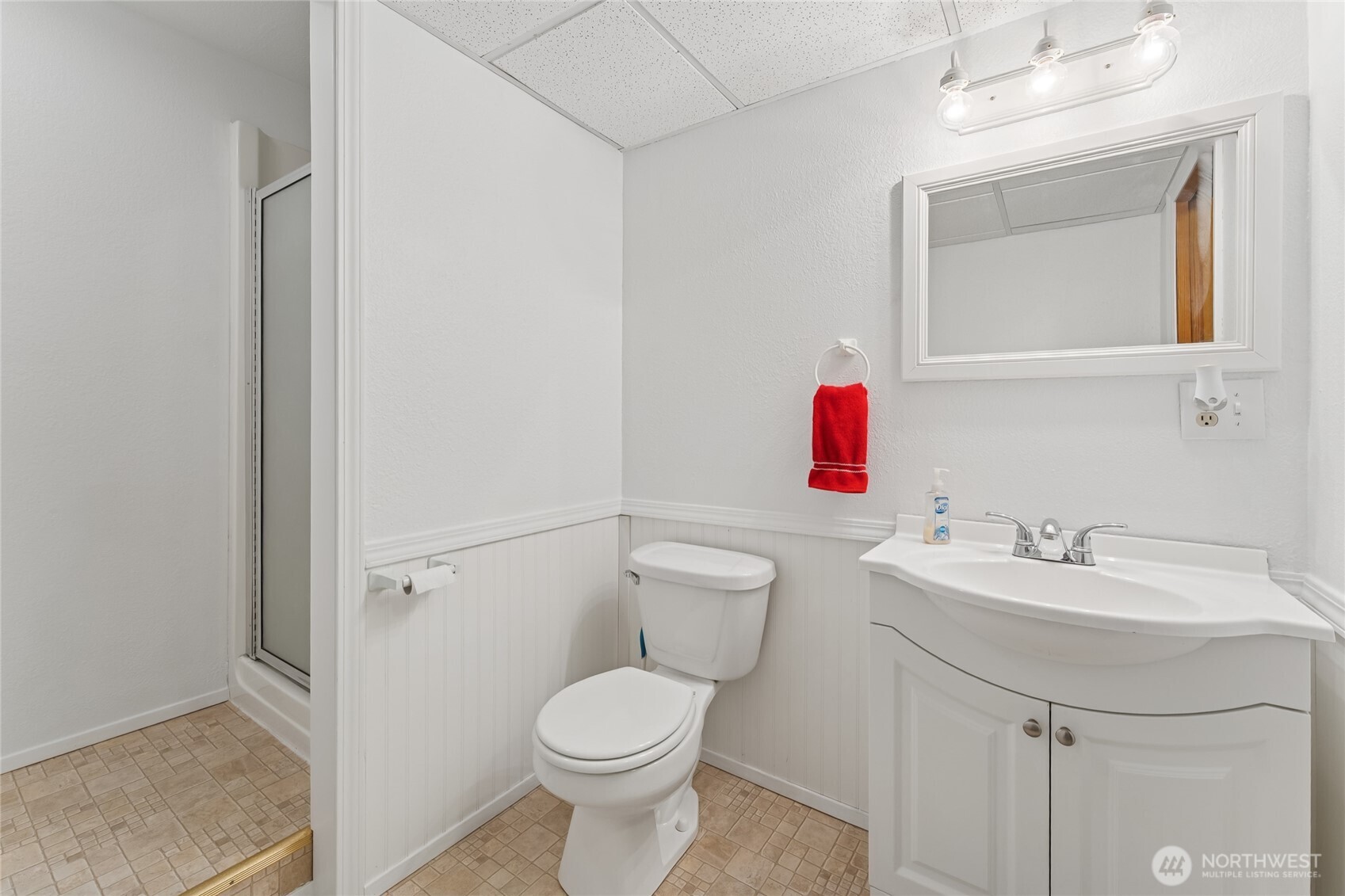 2402 Southeast 21st Street Renton, WA 98055 - Photo 19 of 24 a bathroom with a sink mirror vanity and toilet