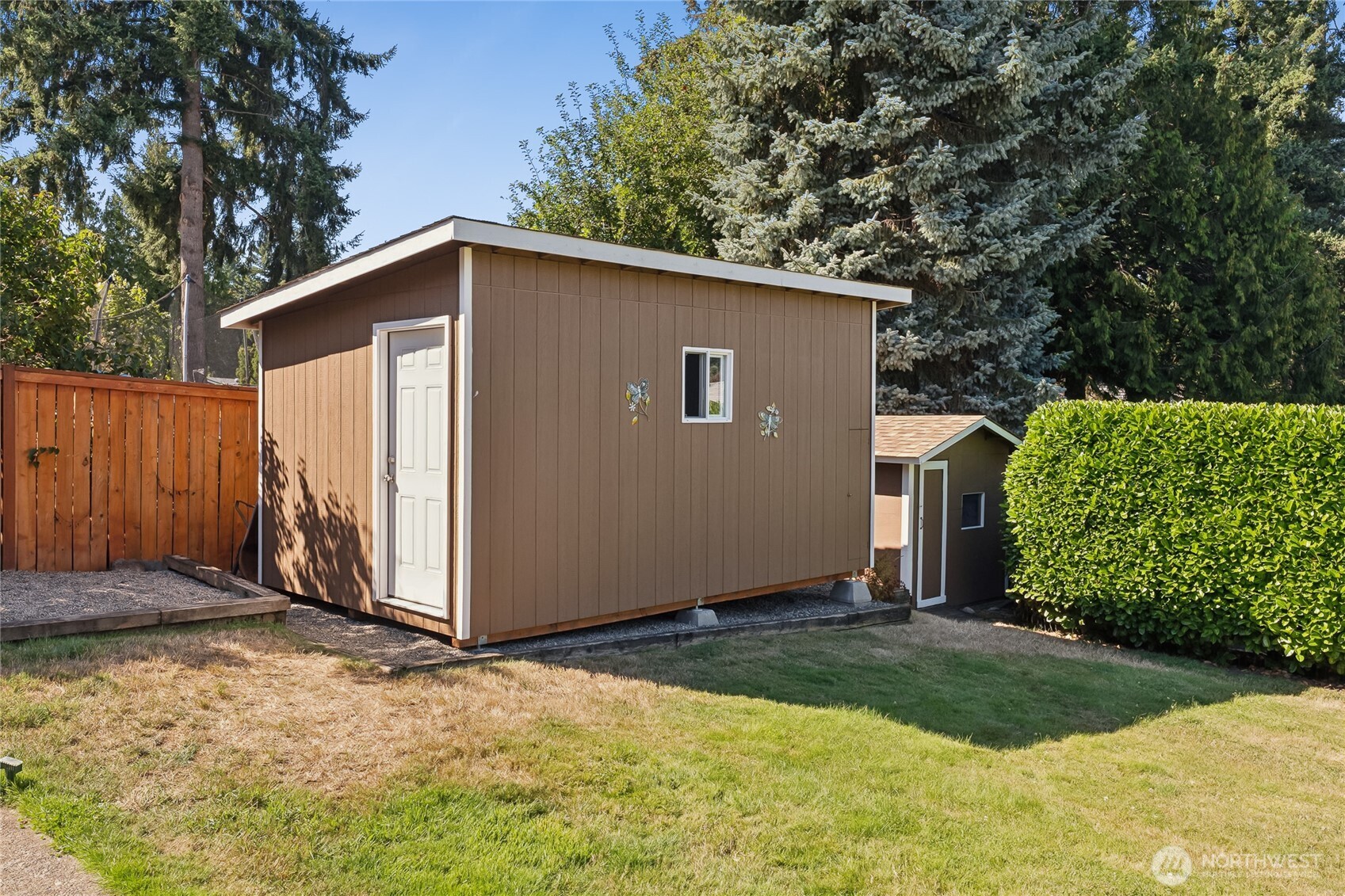2402 Southeast 21st Street Renton, WA 98055 - Photo 23 of 24 a view of backyard of house with wooden fence