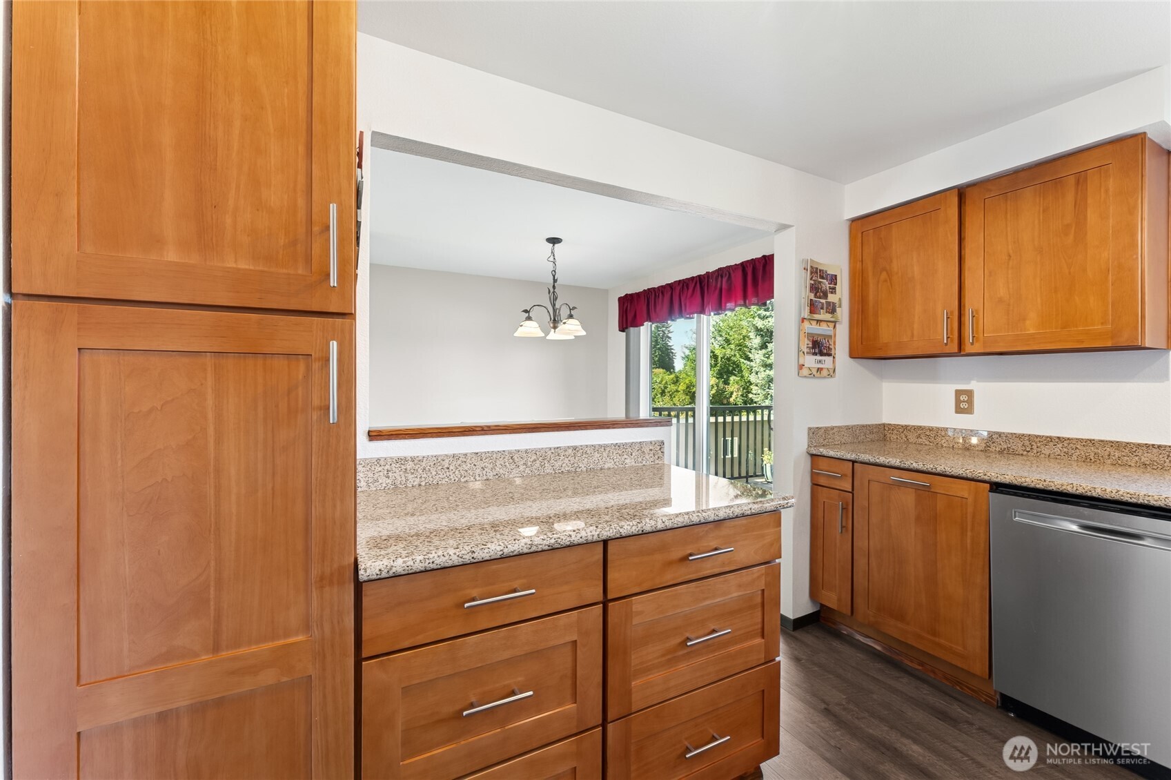 2402 Southeast 21st Street Renton, WA 98055 - Photo 5 of 24 a kitchen with stainless steel appliances granite countertop cabinets and a potted plant