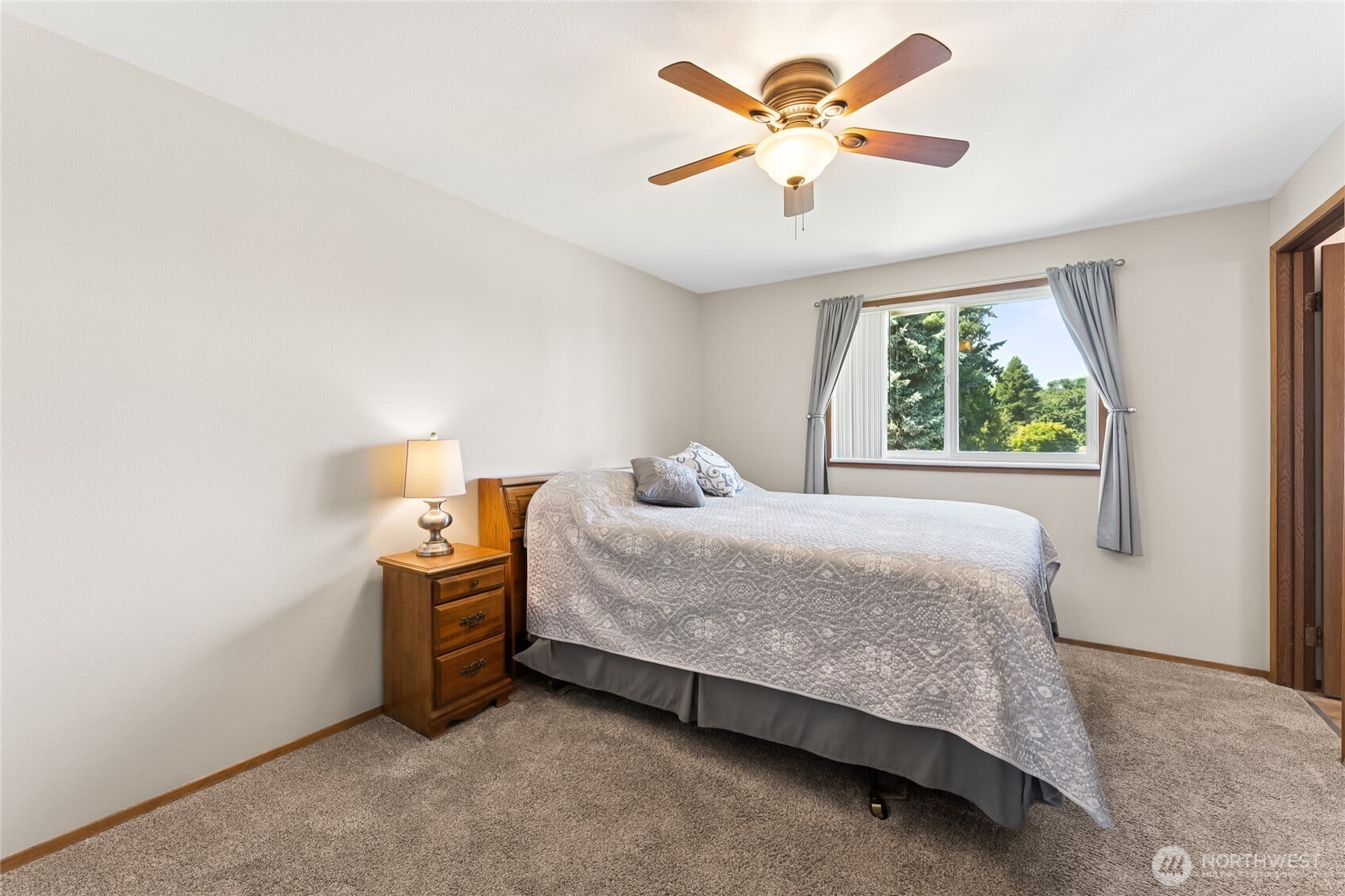 2402 Southeast 21st Street Renton, WA 98055 - Photo 10 of 24 a bedroom with a bed and a large window